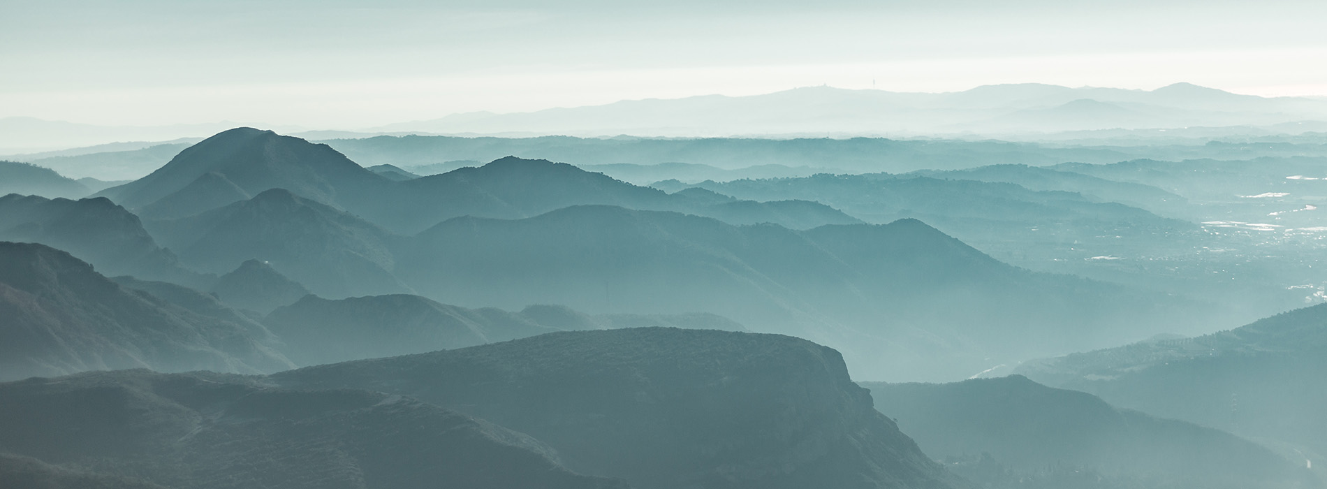 Landscape image of blue tone mountain range