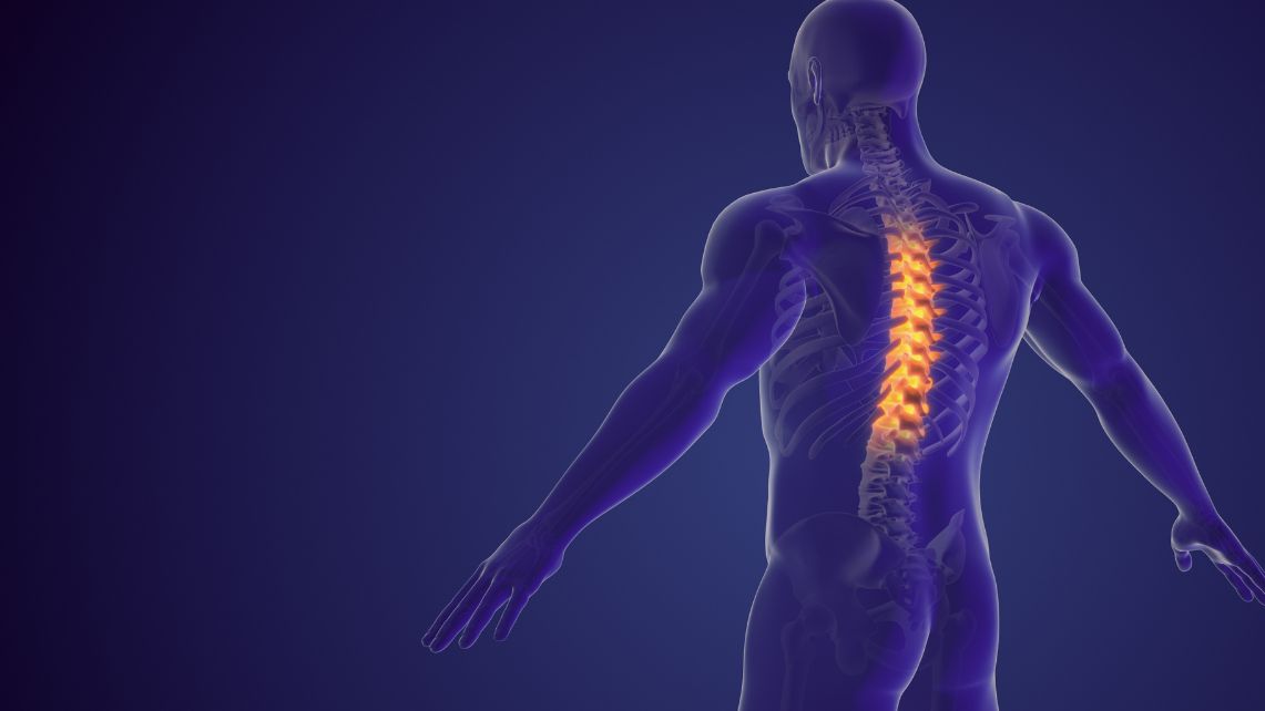 Illustration of a human figure with the spine highlighted in bright orange to depict spinal cord injury.